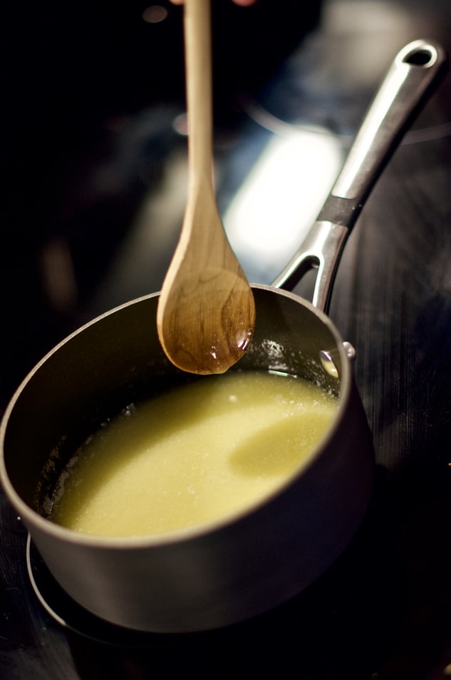 melted ghee in a pan with spoon